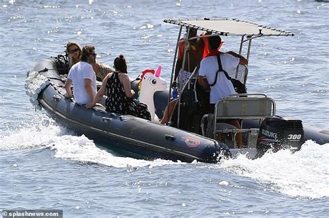 Rita Ora Struggles To Contain Her Ample Assets As She Rocks A Tiny Black Bikini In Ibiza Daily