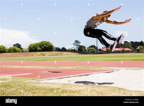 Athlete Performing A Long Jump Stock Photo Alamy