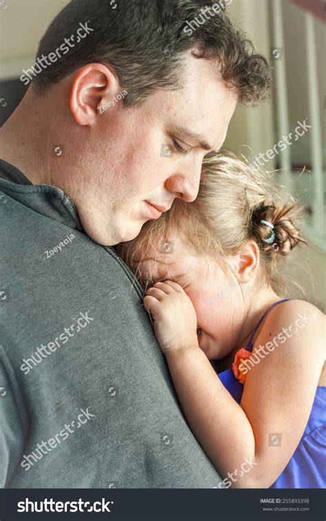 Father Comforting His Crying Daughter Photos, Images & Pictures ...