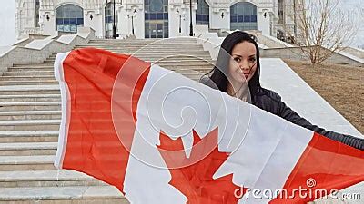 Brunette Girl With Canada Flag In Her Hands Smiling Stock Footage