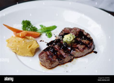 Grilled Steak With Black Pepper Sauce And Mashed Potato Stock Photo Alamy