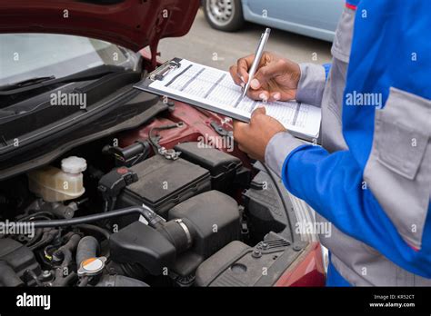 Mechanic Checking Car Engine Stock Photo Alamy