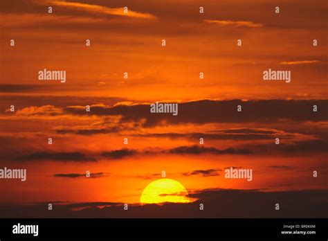 A Firey Sun With An Orange Sky Landscape Format Stock Photo Alamy