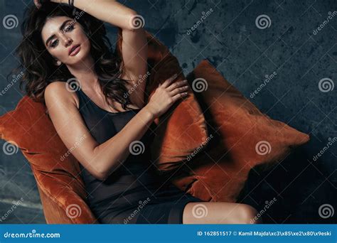 Portrait Of A Sensual Brunette Lady Sitting On The Antique Armchair Stock Image Image Of