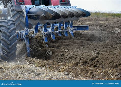 Tractor Plowing a Field. Preparation of the Field after the Season ...