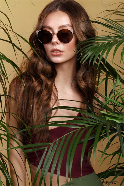 Beautiful Sexy Woman In A Bikini And Sunglasses Posing In Stock Photo 4944324 Crushpixel