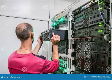 Technical Support Engineer Performs the Installation of a New Server in ...