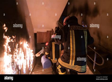 Brave Fireman Descends Stairs Of A Burning Building And Holds Saved