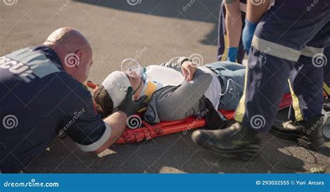 Hands Emergency Oxygen And A Paramedic Group With A Patient Or Victim