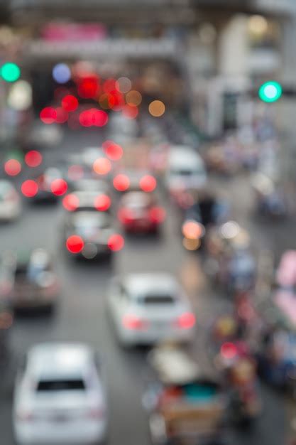 Premium Photo | Blur of traffic jam in the city with traffic light background