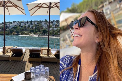 Celebrity Lindsay Lohan Sunbathes In Blue Bikini On Trip