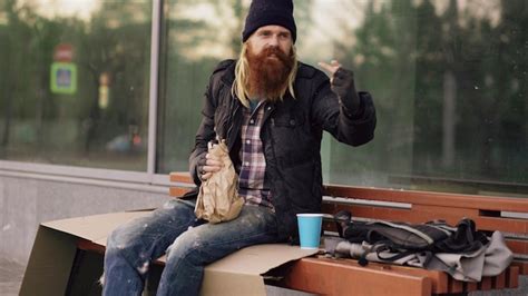 Premium Photo Very Drunk Homeless Man Show Fuck You Sign Into The Camera And Sleeping