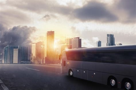 Premium Photo Black Bus Moving On The Road In A Cityscape At Sunset