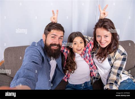 mom dad and daughter love relax together. adoption and charity. family ...