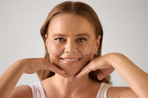 Anti Aging Solutions Mature Woman With Cosmetic Surgery Marks Smiling And Posing With Hands