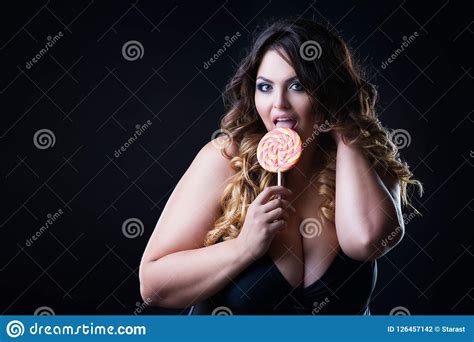 Plus Size Model In Lingerie Licks Lollipop Fat Woman With Big Natural Breast On Black Studio