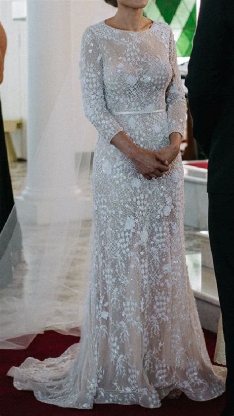 An Elegant Wedding Dress With Nude Underlay To Accentuate The Lace