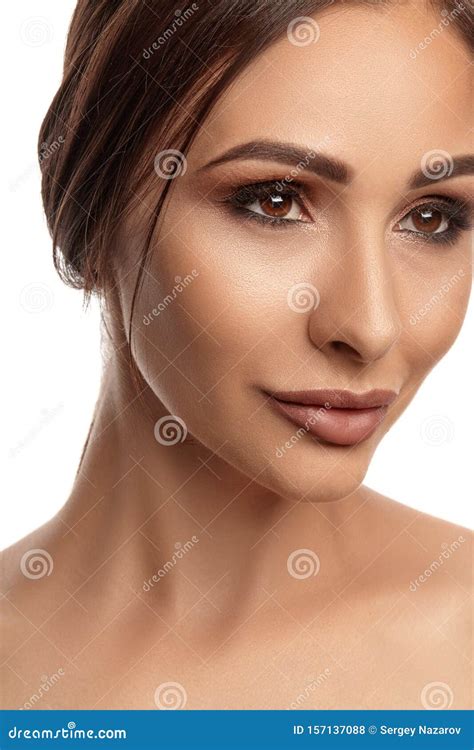 Close Up Portrait Of A Brunette Nude Model Girl With Professional Evening Make Up And Plump Lips
