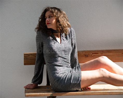 Brunette Wavy Hair Girl In The Mountains Sitting On A Massive Wooden Table Stock Image Image