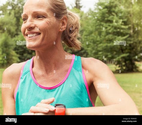 Mature Woman Working Out Outdoors Smiling Stock Photo Alamy