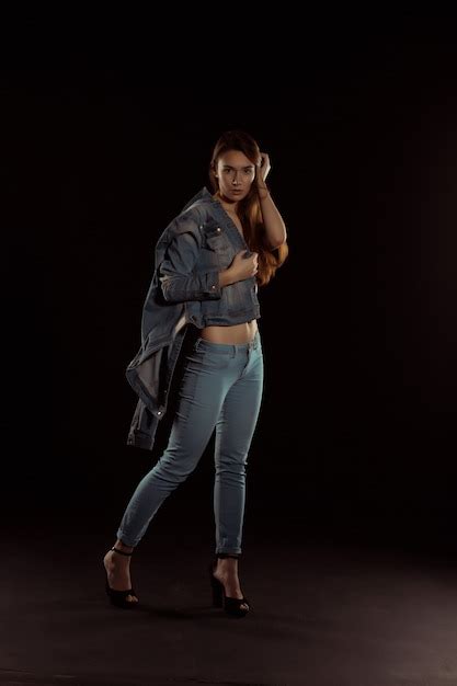 Premium Photo Seductive Brunette Woman With Long Hair Posing On A Black Background