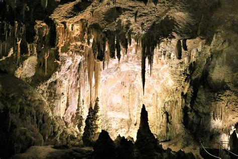 A cave filled with lots of cave like formations photo – Free Cave Image