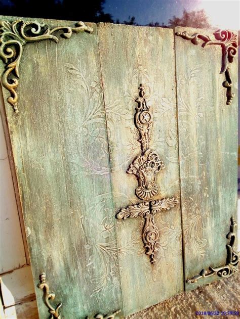 An Old Wooden Door With Ornate Carvings On It