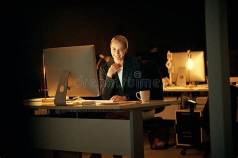 Staying Late To Finish A Last Minute Project A Mature Businesswoman Working Late At The Office
