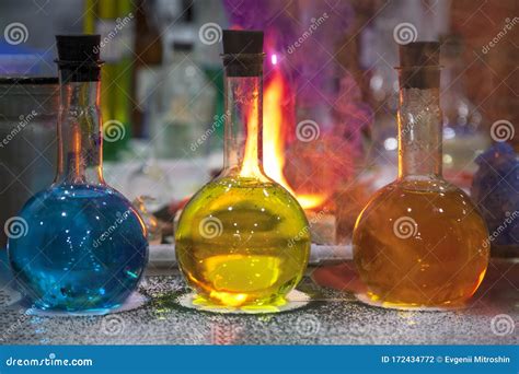 Chemical Laboratory Flasks With Colored Reagents Red Smoke From The