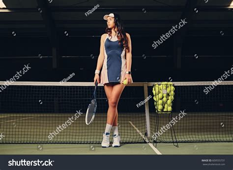 Sexy Brunette Female Tennis Player Posing Stock Photo