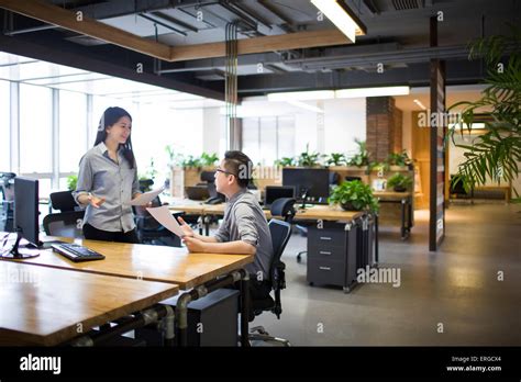 workers talking  office stock photo alamy