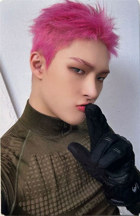 A Man With Pink Hair And Black Gloves