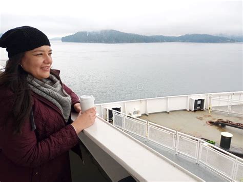 40 Year Old Latina Woman Drinks Coffee On A Ferry In Cold Weather Crosses The Border And Dreams