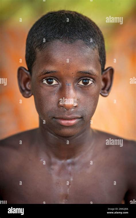 Young African Boy With No Shirt With Colourful Background In Mali West