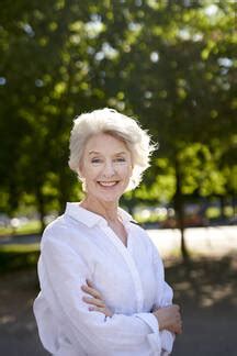 Portrait Of Smiling Mature Woman Outdoors Stock Photo