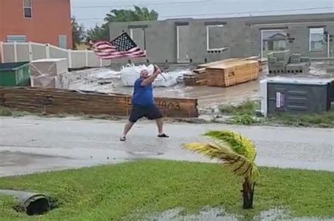 Florida man waves American flag in Hurricane Ian's face