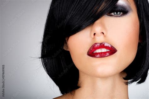 Beautiful Brunette Woman With Shot Hairstyle And Sexy Red Lips Stock Photo Adobe Stock