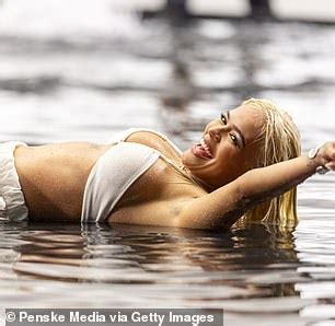 Karol G Leaves Nothing To The Imagination As She Goes BRALESS Beneath Bizarre Sheer Nude Mini