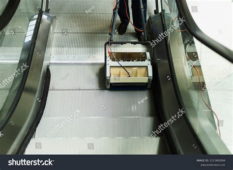 Male Cleaner Cleaning Escalator Mechine Modern Stock Photo 2111882894 ...