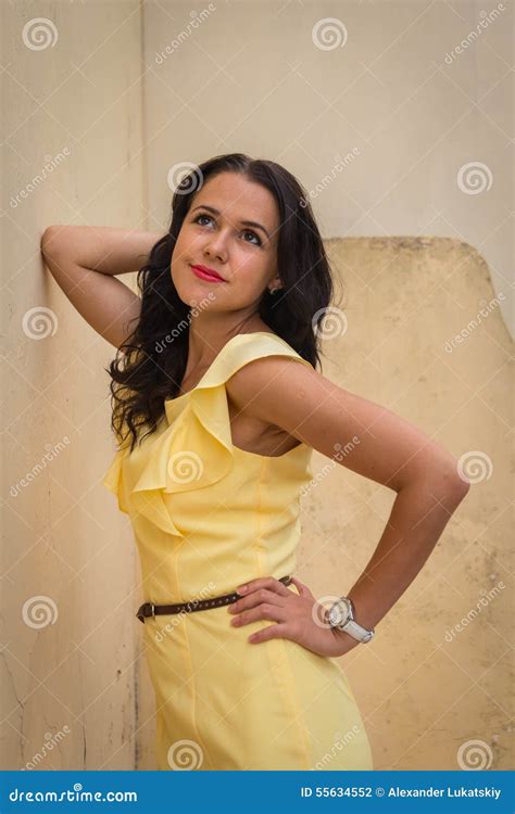 Beautiful Brunette In A Yellow Dress Stock Photo Image Of Cute