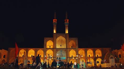 Yazd, Iran, 2022- Amir Chakhmaq complex with people in streets at night