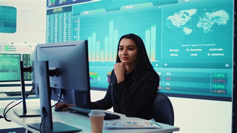 Indian sales manager verifies infographics plan in company coworking