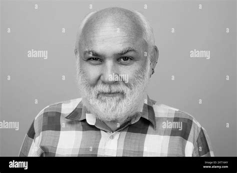 Golden Age Grandfather Mature Bald Man With Grey Beard On Studio Background Portrait Of Senior