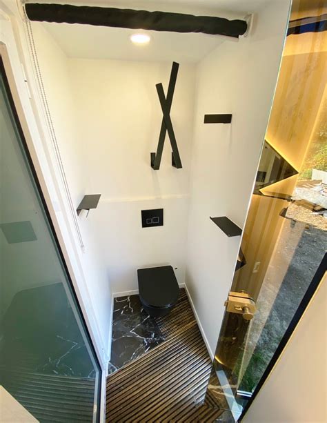 Remarkable 'Micro Mansion' Tiny Home Has a Lounge Pit, Elevated Bed