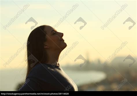 Woman Silhouette Breathing Deeply Fresh Air At Sunset Royalty Free