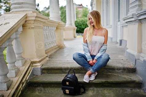 Blonde Girl Wear On Jeans With Backpack Posed Against Vintage House 8661947 Stock Photo At Vecteezy