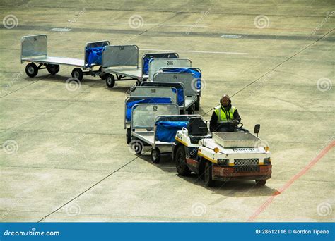 Airport Baggage Carrier Train On Tarmac Editorial Photo - Image: 28612116