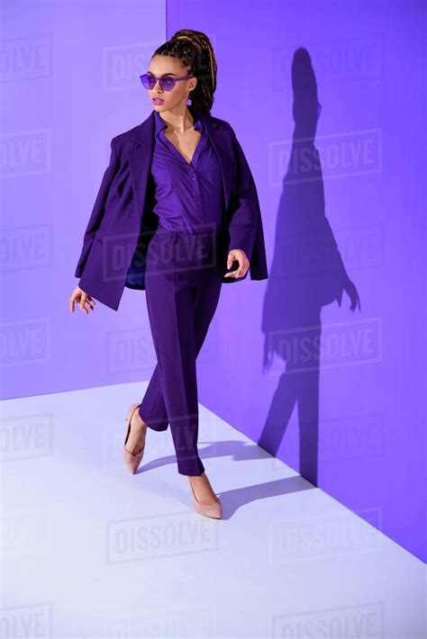 Beautiful Fashionable African American Girl Posing In Purple Suit