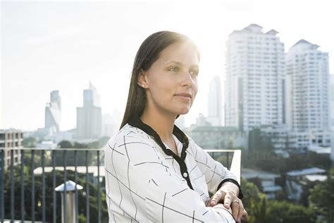 Portrait Of Brunette Business Woman On Rooftop Stock Photo