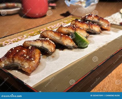 Close Up Cut Grilled Japanese Eel Or Unagi Kabayaki With Sesame On A